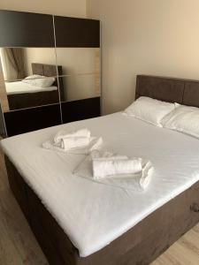 A bed or beds in a room at CENTER APARTMENT PLOVDIV