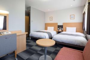 
Tempat tidur dalam kamar di Comfort Hotel Nagasaki
