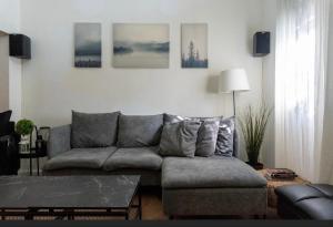 a living room with a couch and a table at Ofek's place - NOGA in Tel Aviv