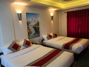 Hotel Sakura Durbarにあるベッド