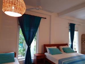 Una cama o camas en una habitación de JJ JungleJoy Villa