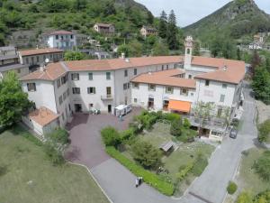 an aerial view of a large white building with a driveway at Le Prieur&eacute; in Saint-Dalmas-de-Tende