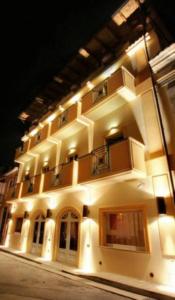 a large building with lights on the side of it at B&B San Matteo in Scalea