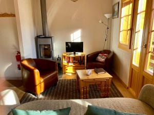 TV a/nebo společenská místnost v ubytování Chalet Amos