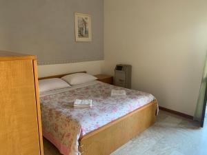 Postel nebo postele na pokoji v ubytování Hotel Apollo