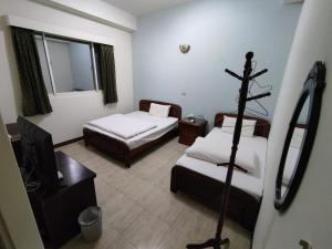 Postel nebo postele na pokoji v ubytování 鴻景山莊民宿 b&B