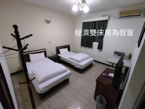 Katil atau katil-katil dalam bilik di 鴻景山莊民宿 b&B
