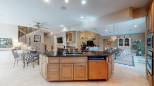 an open kitchen and living room with a large island at 2 Off Shore in Hilton Head Island