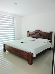 Кровать или кровати в номере Casa Condominio Diomedes Daza Valledupar