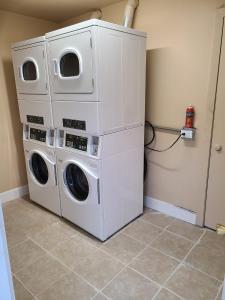 two washing machines stacked on top of each other in a room at Clarysville Motel in Frostburg