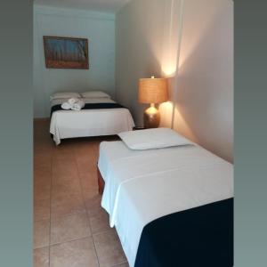 Voodi või voodid majutusasutuse Hotel Kevin toas