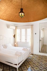 En eller flere senge i et værelse på Casa Cigala 8 Bedrooms