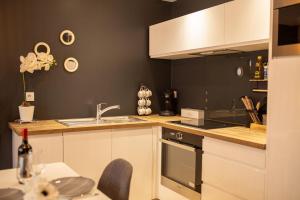 Kuchyň nebo kuchyňský kout v ubytování Appartement Le Labes