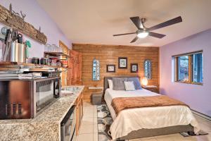 a bedroom with a bed and a kitchen at Cozy Mtn Getaway - Steps to Beech Mountain Resort! in Beech Mountain