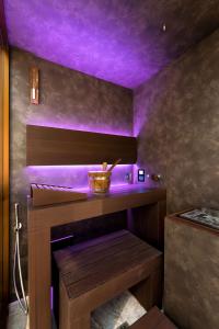 Postel nebo postele na pokoji v ubytování F1RST Suite Apartment & SPA