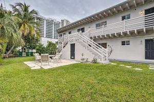 a backyard of a house with a staircase at Cozy West Palm Beach Condo 1 Block to Shore! in West Palm Beach
