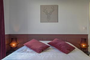 Postel nebo postele na pokoji v ubytování Ferme de la Bertinière