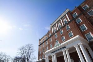 a large brick building with a building with a courthouse at Rodd Charlottetown in Charlottetown