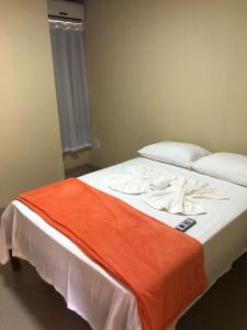 Postel nebo postele na pokoji v ubytování Sunset Hotel