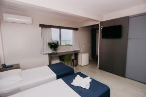 Postel nebo postele na pokoji v ubytování Pajuçara Hotel Express