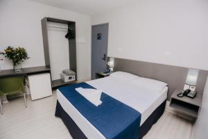 Postel nebo postele na pokoji v ubytování Pajuçara Hotel Express