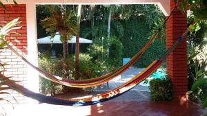 a hammock in front of a house at Casa Grande in San Miguel