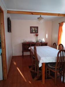 a dining room with a table and chairs at Casa en algarrobo in Algarrobo