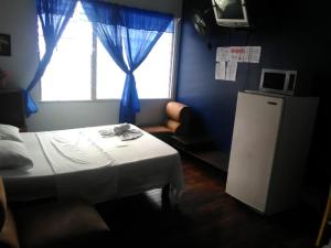 Hotel Marruecos C.R. tesisinde bir odada yatak veya yataklar
