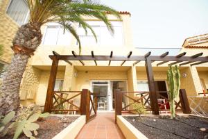 A balcony or terrace at Book Jet - HIBISCUS BEACH FRONT
