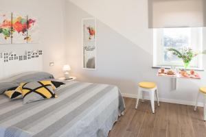 Postel nebo postele na pokoji v ubytování Le terrazze di casa Bonelli