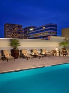 a group of chairs sitting on top of a building at The Royal Sonesta Houston Galleria in Houston