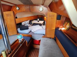 A bed or beds in a room at Sleep on a Sailing Boat Barcelona