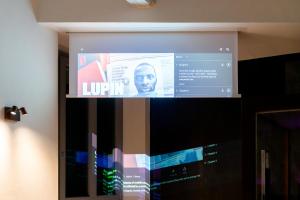 TV a/nebo společenská místnost v ubytování F1RST Suite Apartment & SPA