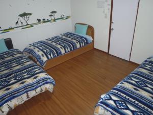 Ένα ή περισσότερα κρεβάτια σε δωμάτιο στο Mike's B&B Tokoname