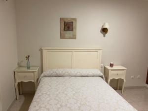 Postel nebo postele na pokoji v ubytování Hostal Restaurante Puerto Blanco