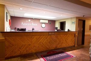a lobby with a reception desk in a emergency room at AmericInn by Wyndham Medora in Medora