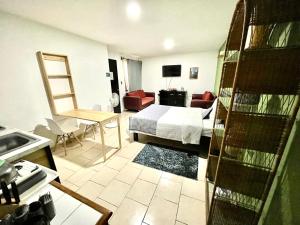 a hotel room with a bed and a bathroom at Casa San Andrés in Cholula