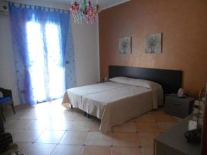 Säng eller sängar i ett rum på Brezza di Mare
