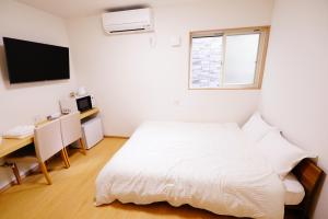 Cama ou camas em um quarto em 暁 Twilight Osaka Inn
