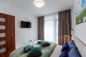 Televízia a/alebo spoločenská miestnosť v ubytovaní Lovely apartman- free parking