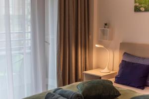 Posteľ alebo postele v izbe v ubytovaní Lovely apartman- free parking