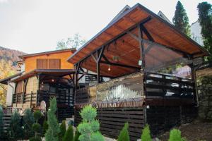 a house with a large window and a roof at Casa Flandria in Sinaia