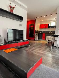 
A television and/or entertainment center at Apartments Rosina
