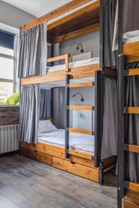 a bunk bed room with two bunk beds at Хостел Впечатления in Yekaterinburg