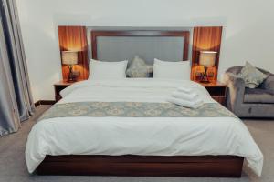 A bed or beds in a room at Sinclair Lake Chad