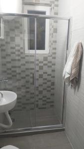 a bathroom with a shower and a sink at Apartman Pavlovic in Leskovac