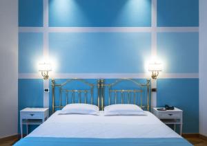 Voodi või voodid majutusasutuse Hotel Settentrionale Esplanade toas