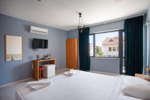 מיטה או מיטות בחדר ב-Zephyros City Otel