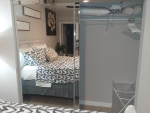 a bedroom with a bed with a glass door at LUXURIOUS COZY STUDIO. in Tampa