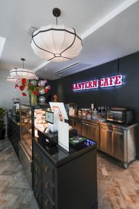 a kitchen cafe with a sign on the wall at The Lantern Hatyai Hotel in Hat Yai